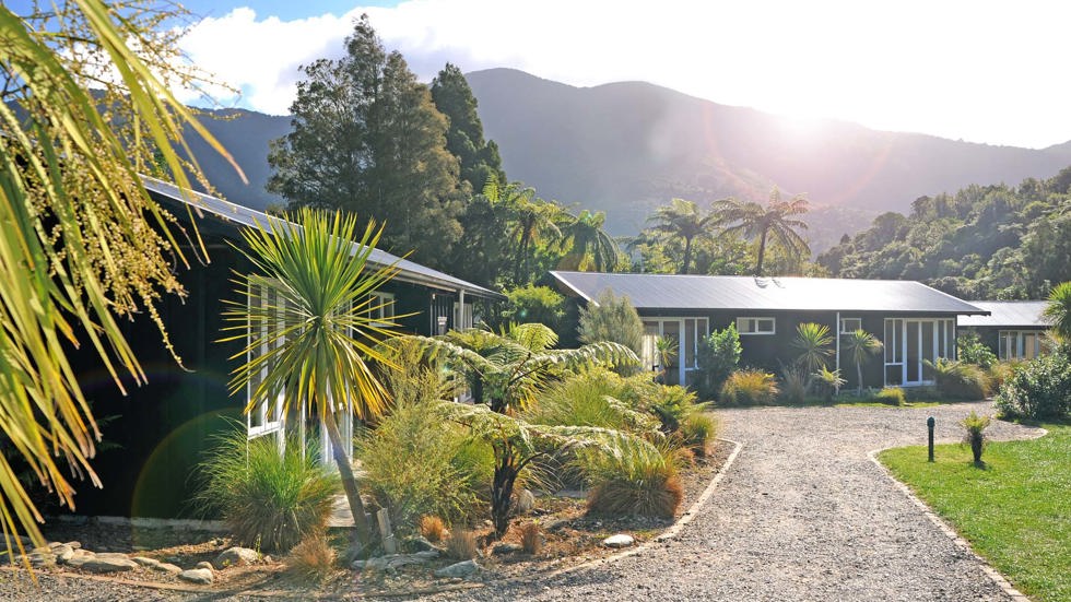 Morning sunrise from behind the hill  seen from beside Endeavour Suites at Furneaux Lodge in the Marlborough Sounds at the top of New Zealand's South Island.