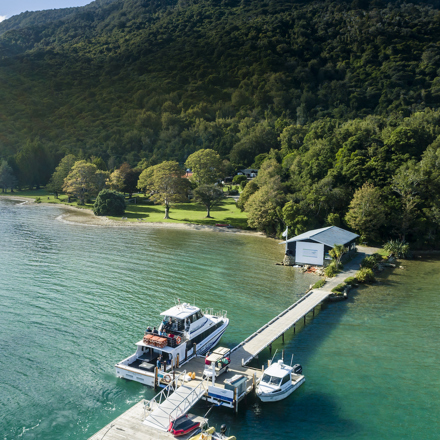 Furneaux Lodge jetty is in the foreground and Furneaux Lodge jetty in the background, in the Marlborough Sounds at the top of New Zealand's South Island.