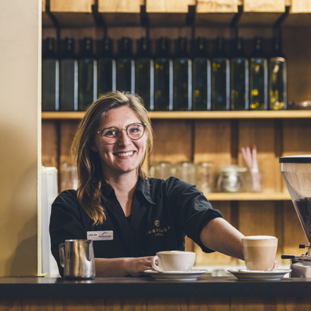 A barista makes coffee at the Furneaux Lodge Restaurant in the Marlborough Sounds at the top of New Zealand's South Island.