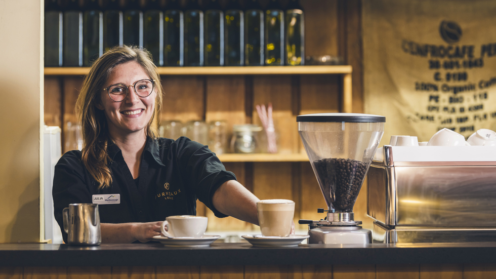 A barista makes coffee at the Furneaux Lodge Restaurant in the Marlborough Sounds at the top of New Zealand's South Island.