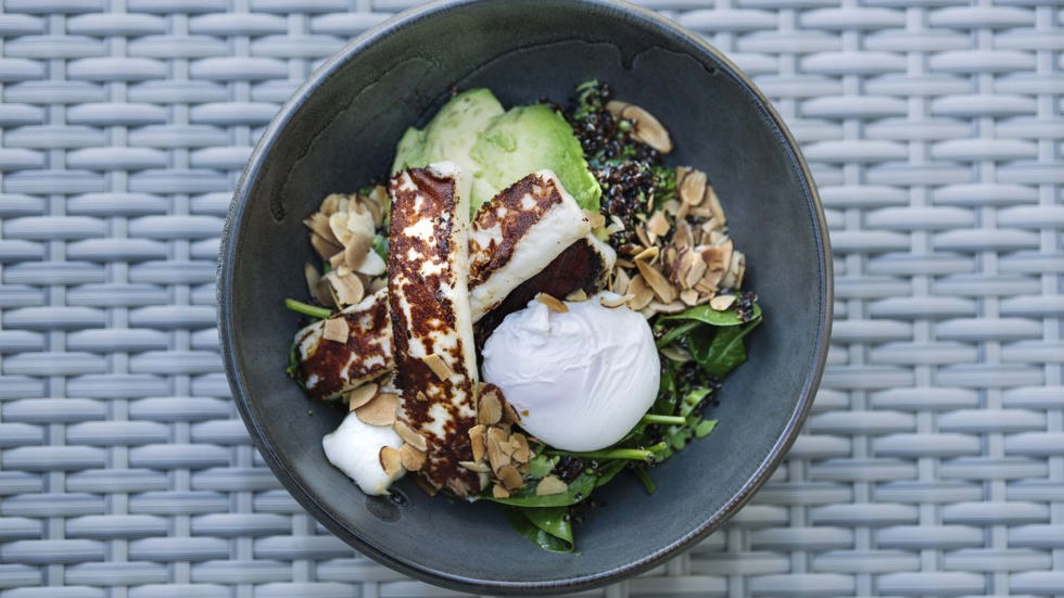 A breakfast bowl with avocado, haloumi and spinach, with egg at the Furneaux Lodge Restaurant in the Marlborough Sounds at the top of New Zealand's South Island