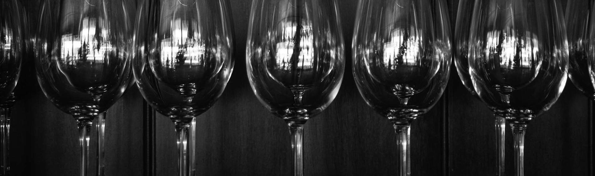 Rows of wine glasses on a shelf at the Furneaux Lodge Restaurant in the Marlborough Sounds at the top of New Zealand's South Island.