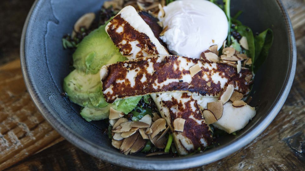 Breakfast bowl with haloumi, avocado, egg and spinach at the Furneaux Lodge Restaurant in the Marlborough Sounds at the top of New Zealand's South Island.