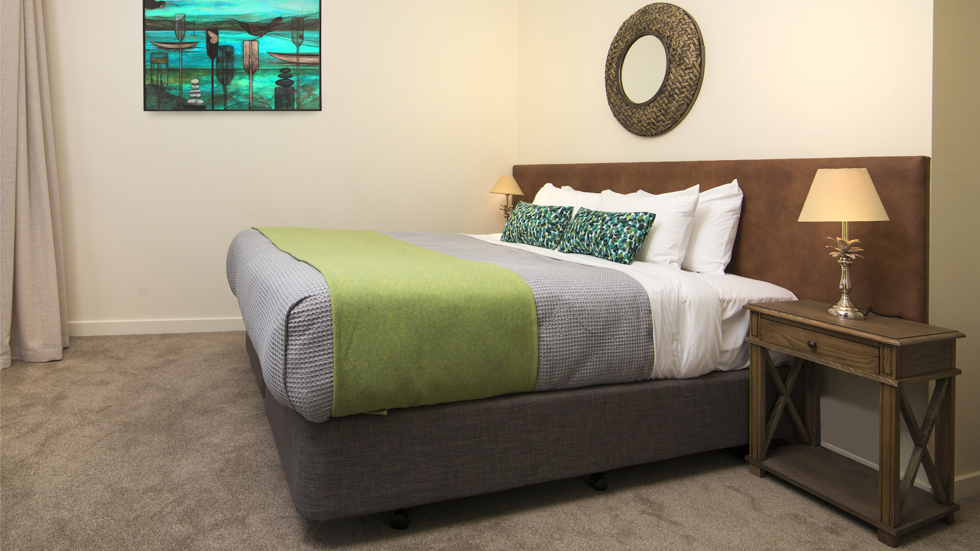 A side view of an Endeavour Suite bedroom area at Furneaux Lodge in the Marlborough Sounds, New Zealand.